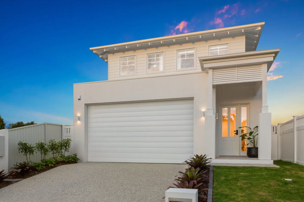White residential garage door showing a sectional type of garage door Gliderol offers. - Gliderol